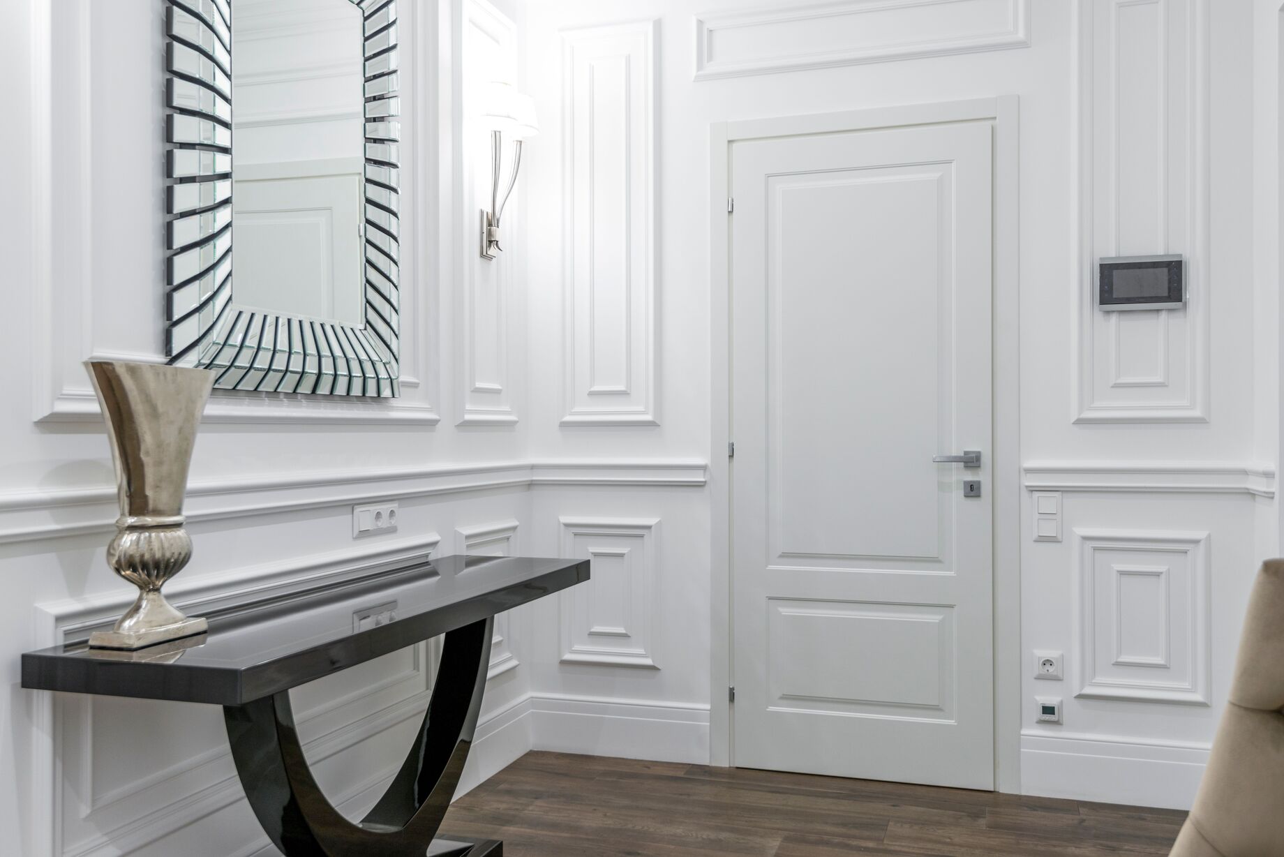 Warm modern entryway showcasing organized home storage
